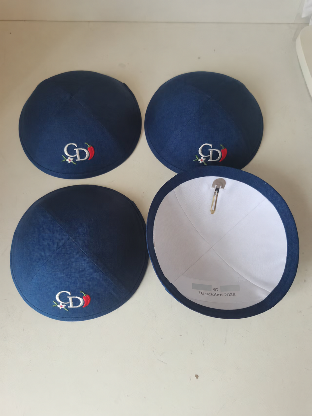 Navy kippahs with monogram embroidery and interior date printing; interior names hidden